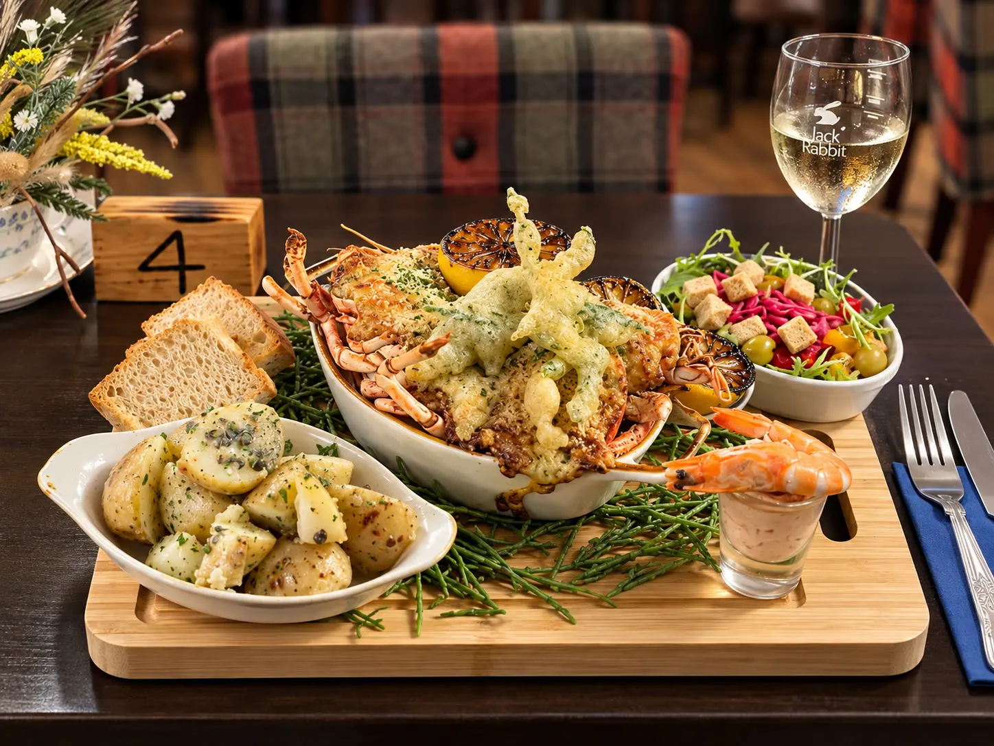 Lobster thermidor served with buttered herb potatoes, dressed salad, crusty bread, grilled lemon and prawn cocktail at The Malcolm Arms