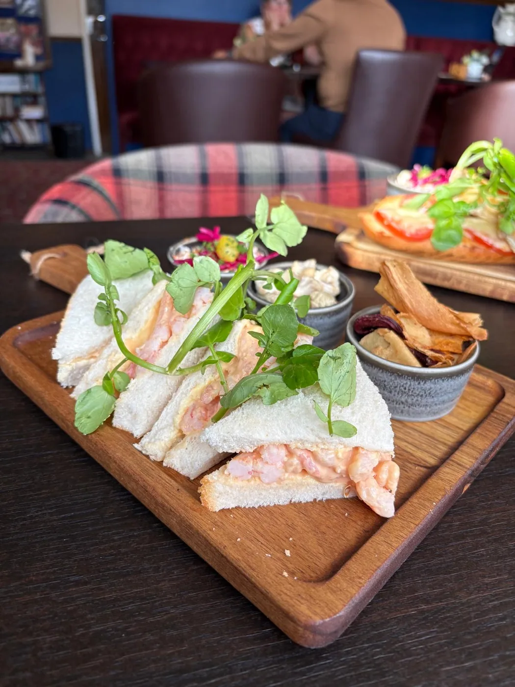 Prawn sandwich board with slaw and crisps